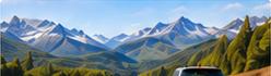 Car traveling through a mountain valley